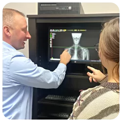 Chiropractor Royal Oak MI Franklin Norton With Patient X-Ray
